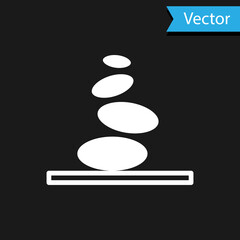 White Stack hot stones icon isolated on black background. Spa salon accessory. Vector