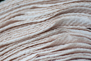 Background and pattern from stack of tissue paper, close up layer of tissue paer.