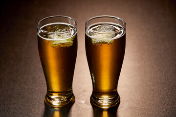 glass of beer on dark background