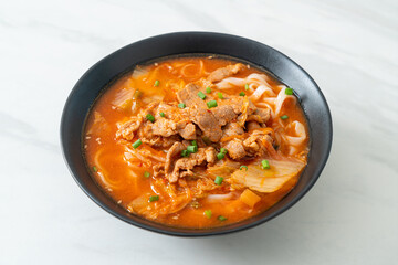 Korean udon ramen noodles with pork in kimchi soup