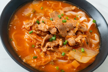 Korean udon ramen noodles with pork in kimchi soup