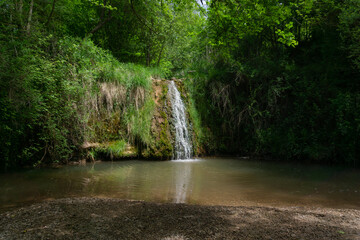 Landscape of a waterfall in the middle of the forest in the town of Moia
