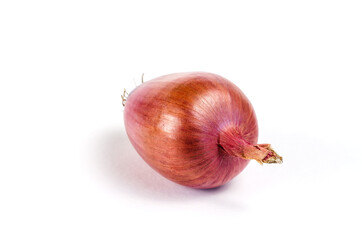 A ripe raw unpeeled onion on a white background. Italian Onion Ramata di Milano. One Ripe root vegetable in the peel.