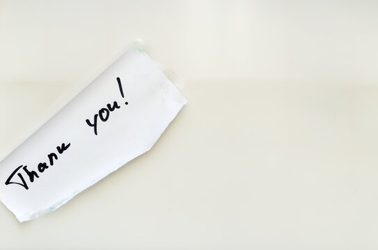 Thank You - A Handwritten Note Floats In The White Water. A Piece Of Paper With Wet Edges. Words Of Gratitude.