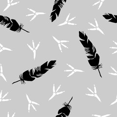 Seamless background with bird feather and bird tracks. Bird footprint. Black and White Background. Seamless Vector pattern.