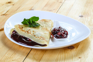 Delicous pancake with fruit jam