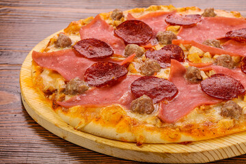 Pizza with ham and pepperoni