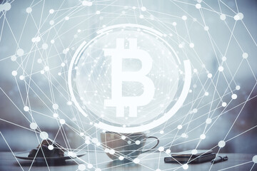 Double exposure of crypto currency theme drawing hologram over coffee cup background in office. Concept of international blockchain.