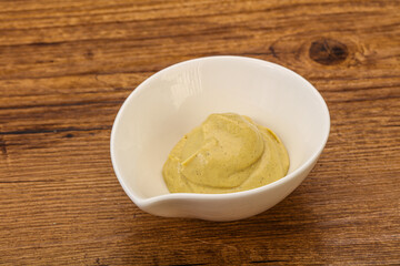 Dijon mustard sauce in the bowl