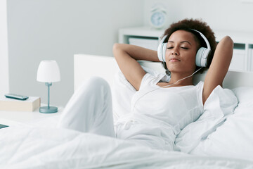 Woman relaxing and listening to music