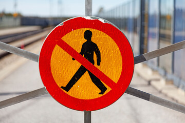 worn road sign which means it is forbidden to go here