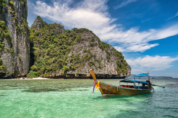 Naklejka na ściany i meble Tropical islands view with long tail boat ocean blue sea water at Pileh Lagoon of Phi Phi Islands, Krabi Thailand nature landscape