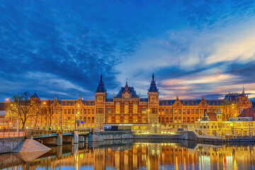 Fototapeta na wymiar Amsterdam Netherlands, night city skyline at Amsterdam Central Station