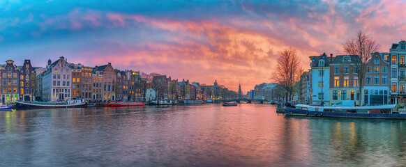 Amsterdam Netherlands, sunset panorama city skyline of Dutch house at canal waterfront - obrazy, fototapety, plakaty