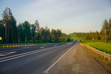 Fototapeta premium Road in Siberia at sunset