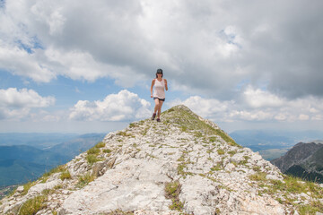 Portrait of woman hiking in the high mountains of central Italy