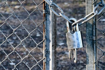 A padlock on a fence