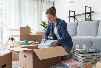 Young woman moving in her new apartment