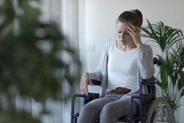 Depressed lonely woman in wheelchair