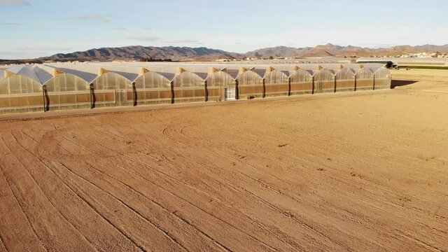 Aerial view of spanish coast landscape with many commercial greenhouses. Industrial agriculture.  Mediterranean region of Mazarron, Sierra de las Moreras in Murcia Spain.