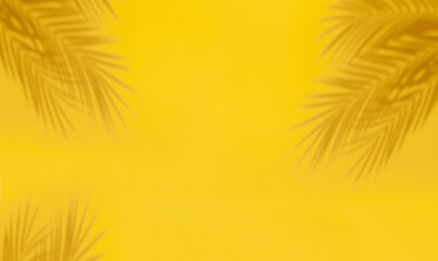 Palm leaf shadows on yellow background