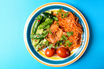 Fresh vegetable salad made of cabagge, carrot, cucumbers and tomatoes with fresh greenery.