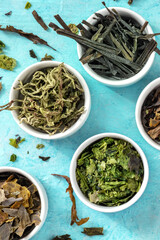 Edible algae, top shot on a blue background, healthy vegan food