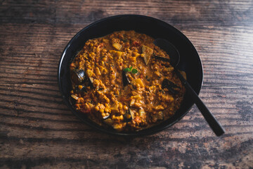 vegan eggplant lentil curry with tomato sauce and coconut milk, healthy plant-based food