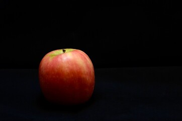 Photo of a red apple in studio