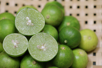 Close up of limes on the basket.