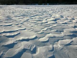 Frozen river covered in snow