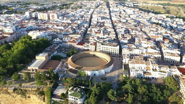 AERIAL - Bullfighting ring in Ronda, Malaga, Spain, wide shot tilt down