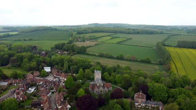 Aerial footage flying towards a village church in Chilham, England.