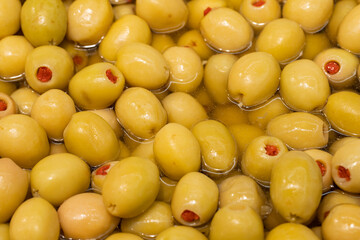 Close-up green olives with pepper filling