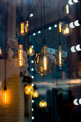 glowing glass light bulbs of different shapes. Decorative decoration of the room