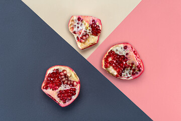 Multiple pomegranates on multicolor backdrop