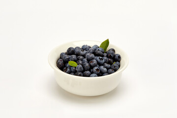Blueberry on a white background.
흰 배경 위의 블루베리