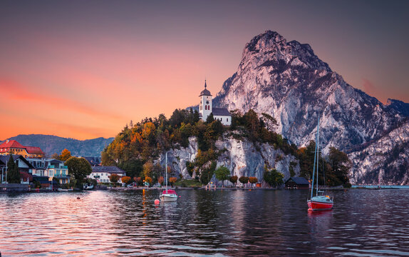 Scenic image of Stunning nature in Austrian alps. Amazing Autumn Landscape with Chapel on a rock over the Traunsee lake in the Alps of Austria. incredible natural background. Travel adventure concept