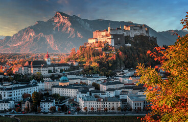 Fototapeta premium Colorful morning cityscape. Stunning view on historic city of Salzburg with famous Hohensalzburg Fortress. Wonderful autumn landscape with picturesque sky. Softlight effect. Salzburger Land, Austria
