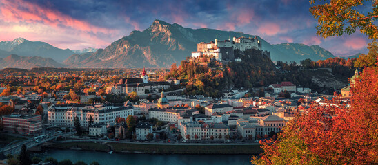 Colorful evening cityscape. Panoramic view on historic city of Salzburg with famous Hohensalzburg Fortress. Wonderful autumn landscape with picturesque sky. Softlight effect. Salzburger Land, Austria - 439271662