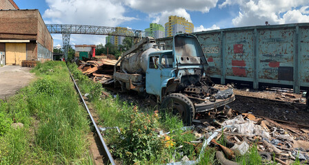 Old wrecked truck car on  junkyard in a pile of rubbish.