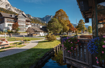 Fototapeta na wymiar Amazing countryside scenery in alps at sunny day. Brauhof village on a Grundlsee lake. Austria. Amazing nature landscape. Picture of village park. concept of Travel and holiday on nature.