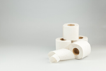 Rolls of Soft Toilet Paper over Gray Background