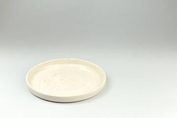 Empty White Ceramic Plate on gray background
