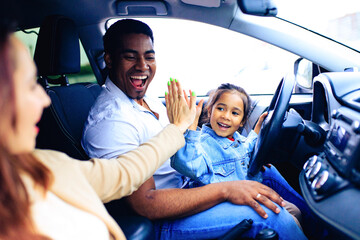 latin hispanic man and beautiful woman with cute daughter ready for trip on car