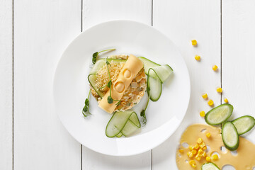 Salad with cheese, cucumbers and corn with mayonnaise