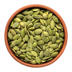 Pumpkin seeds in a bowl isolated on white background. Top view.