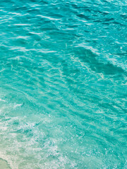 Surface transparent blue sea water.