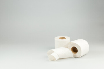 Two Rolls of Toilet Paper over Gray Background