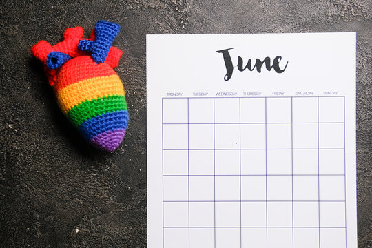 Pride month calendar with LGBT flag cookies. A place for text. Deadline and planning consent. Freedom LGBT symbols.